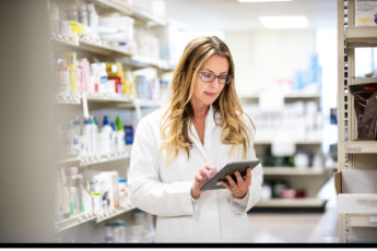 Pharmacist with touchscreen tablet Pharmacist with touchscreen tablet